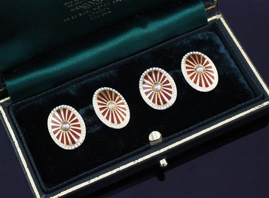 A pair of early 20th century 18ct gold, two colour enamel and seed pearl set cufflinks, in Hancocks box.